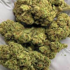 Close-up of Crescendo THCa Flower with vibrant buds and frosty trichomes.