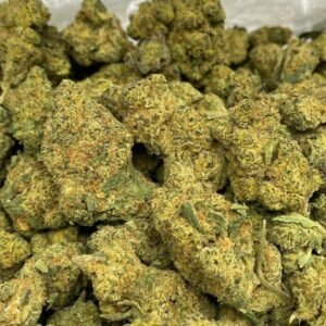 Jokerz THCa Flower – Dense, purple-tinged buds with vibrant orange pistils and a frosty layer of trichomes.