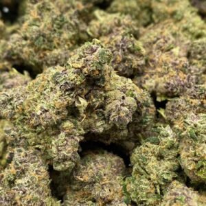 Tropicanna THCa Flower – Bright green buds with orange pistils and frosty trichomes.