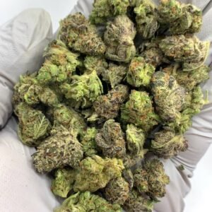 Lemon Zest THCa Flower buds with bright green hues, vibrant yellow pistils, and a frosty layer of trichomes.