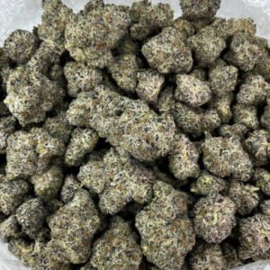 Mango Tango THCa Flower buds with vibrant green and orange hues, covered in frosty trichomes.