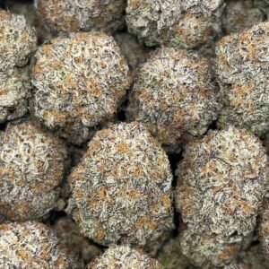 Sweet Tooth THCa Flower buds with frosty trichomes and vibrant green hues, covered with orange pistils.