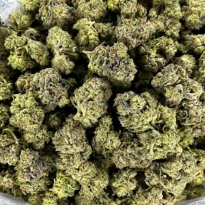 Tangerine Zkittlez THCa Flower buds with vibrant green colors, orange pistils, and frosty trichomes.