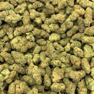 Sour Berry THCa Flower buds featuring deep purple hues, bright orange pistils, and frosty trichomes.