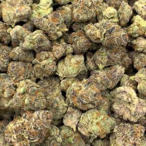 Papaya Punch THCa Flower buds with green and purple hues, orange pistils, and frosty trichomes.