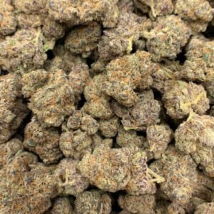 Strawberry Lemonade THCa Flower buds showcasing vibrant green tones, red pistils, and a frosty coating of trichomes.